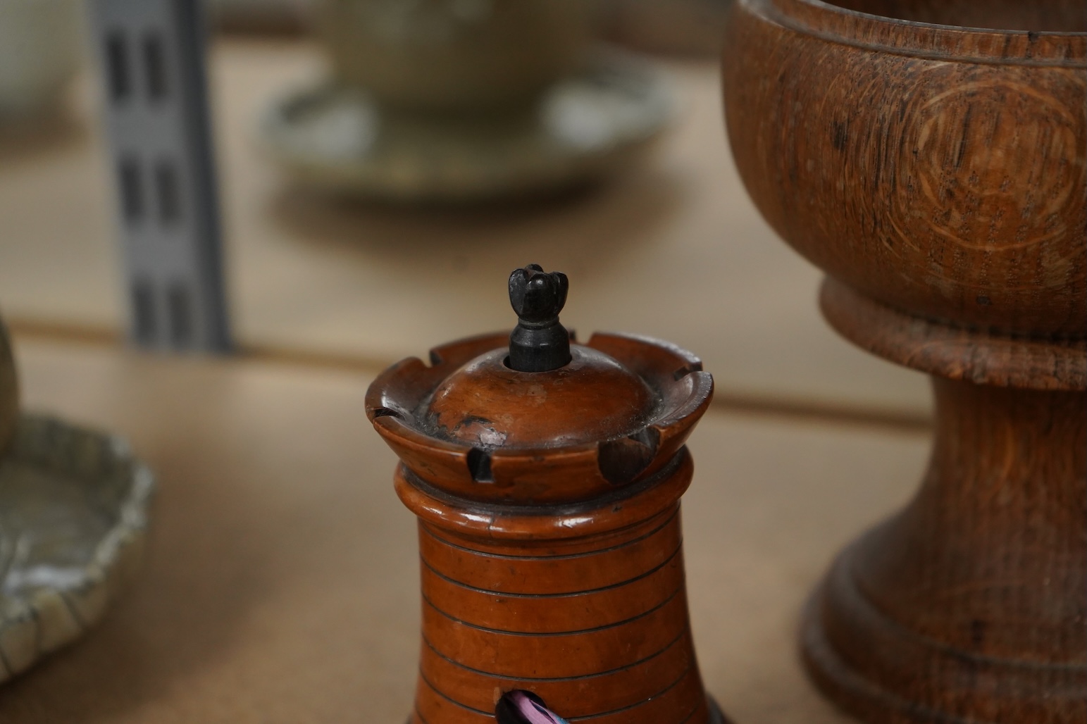 A 19th century treen tower tape measure and an oak goblet with provence label, 13cm